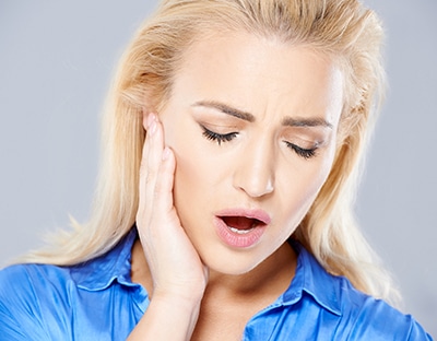 Young woman with TMJ pain