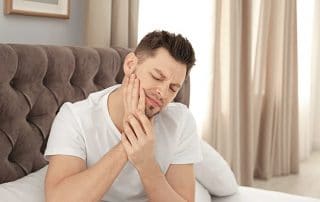 If you wake up with a sore jaw in the morning like this man, it could be linked to sleep apnea